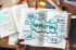 Foto: Notizbuch mit Marketingplanung darin